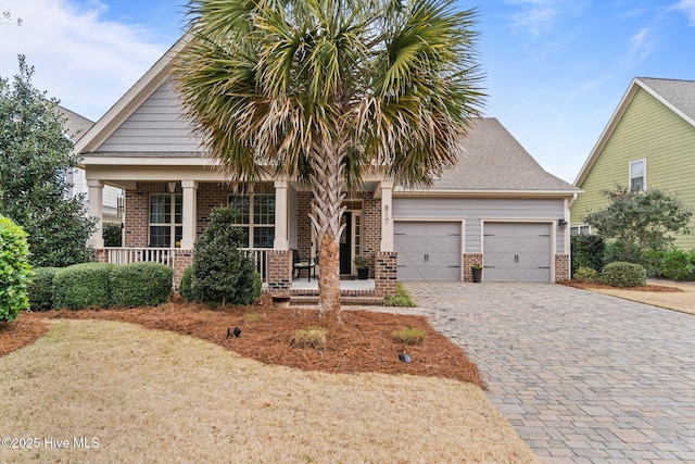 view of front of property with a porch and a garage