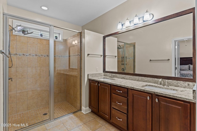 bathroom with vanity, tile patterned floors, and walk in shower