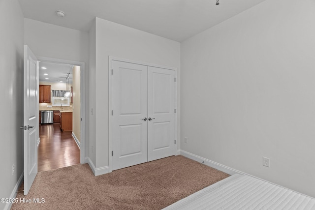 carpeted bedroom with a closet