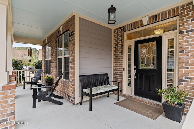 entrance to property featuring covered porch