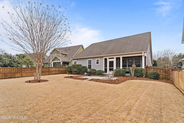 back of property featuring a patio area and a sunroom