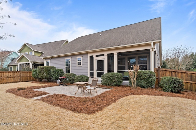 back of house with a patio