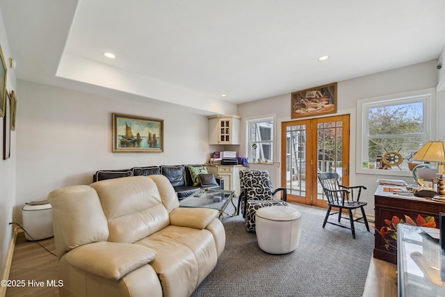 living room with french doors and light hardwood / wood-style floors