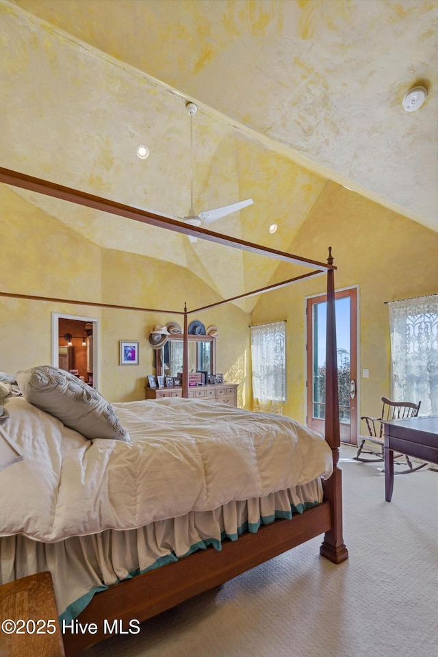 bedroom featuring access to exterior, high vaulted ceiling, and carpet flooring