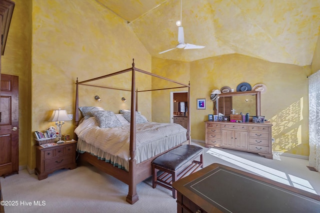 carpeted bedroom featuring high vaulted ceiling