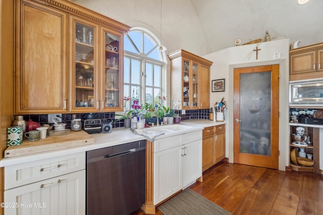 kitchen with sink, dishwasher, backsplash, dark hardwood / wood-style floors, and white cabinets