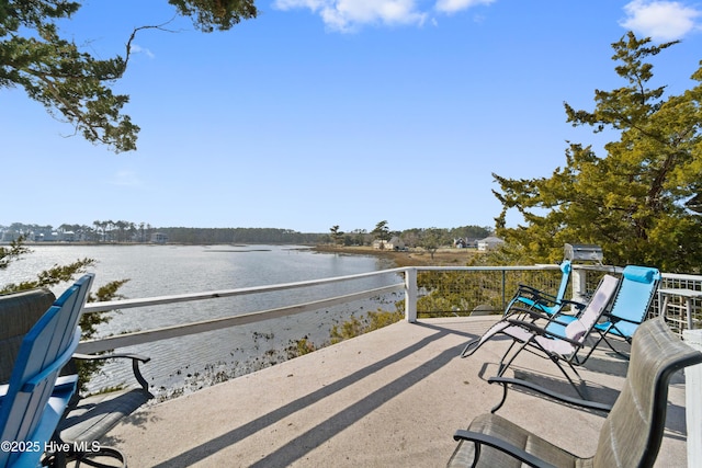 view of patio featuring a water view