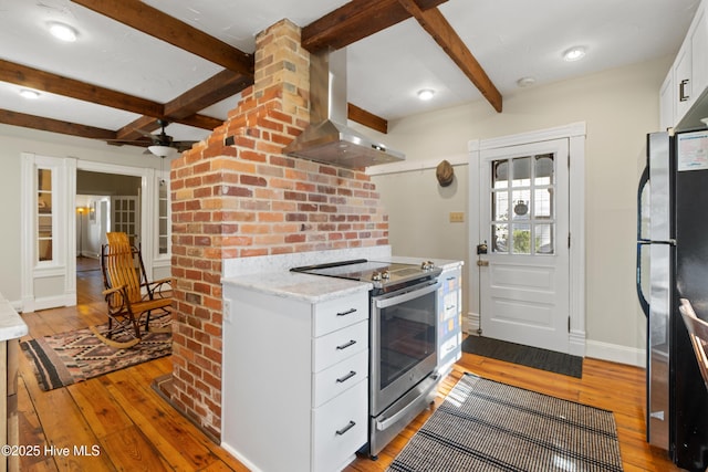 kitchen featuring white cabinetry, fridge, island exhaust hood, stainless steel electric stove, and light hardwood / wood-style floors