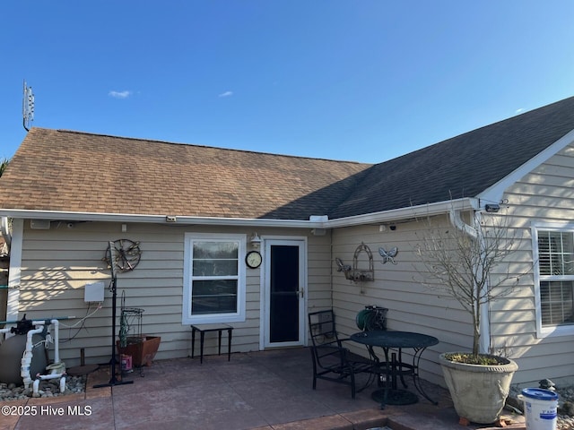 back of property featuring a patio