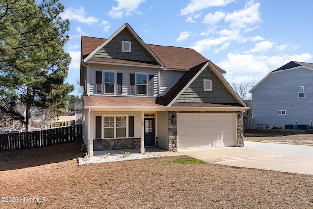 view of front of property featuring a garage and covered porch