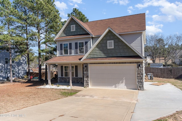 view of front of home featuring a garage and covered porch