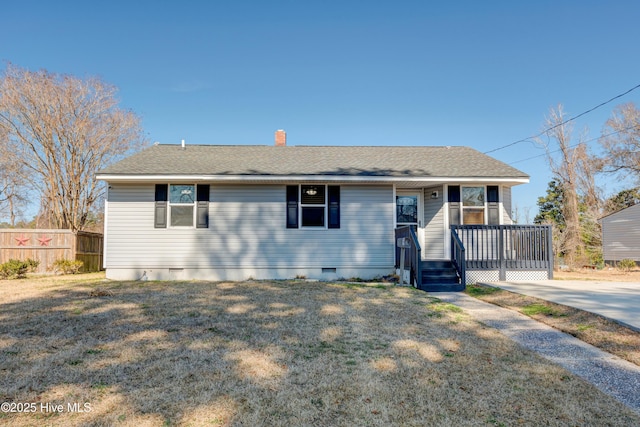 view of front of house with a shingled roof, crawl space, fence, and a front lawn