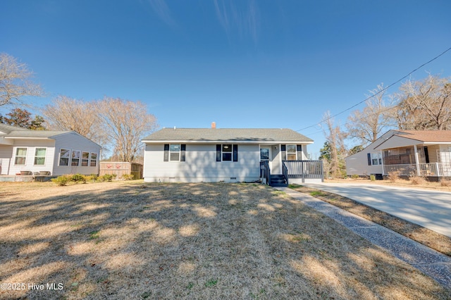 view of front of house with crawl space and a front lawn