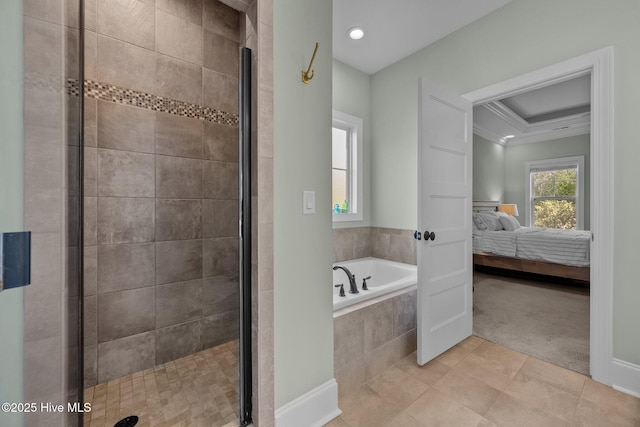 ensuite bathroom featuring a raised ceiling, connected bathroom, crown molding, a shower stall, and a bath