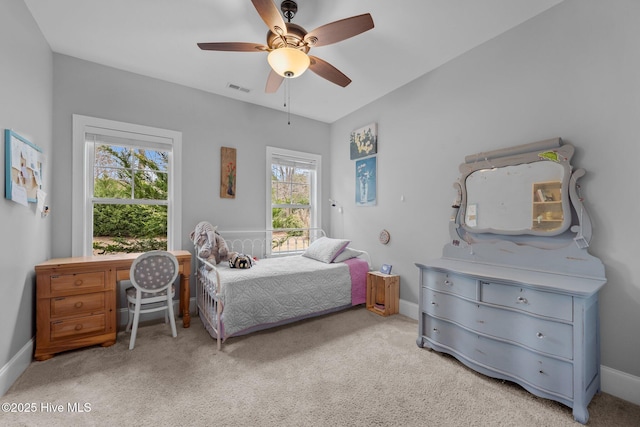 bedroom featuring light carpet, baseboards, visible vents, and ceiling fan