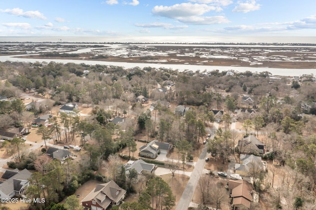 birds eye view of property with a water view and a residential view