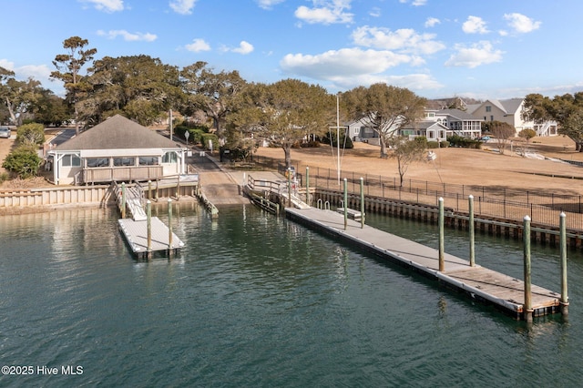 dock area with a water view and a residential view