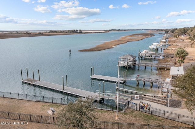 dock area with a water view and fence