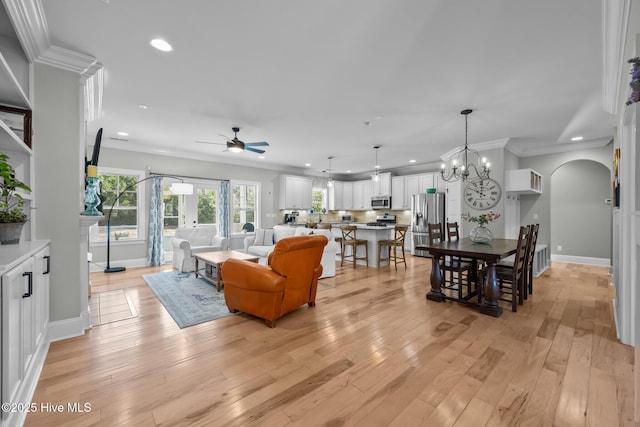 living area with recessed lighting, light wood-type flooring, and crown molding