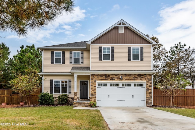 craftsman-style house with a garage and a front lawn