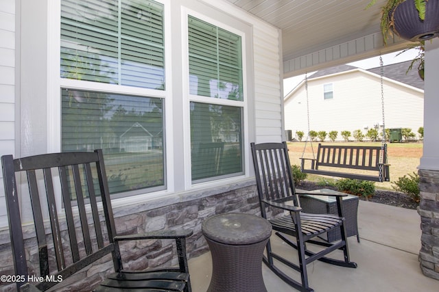 view of patio featuring a porch