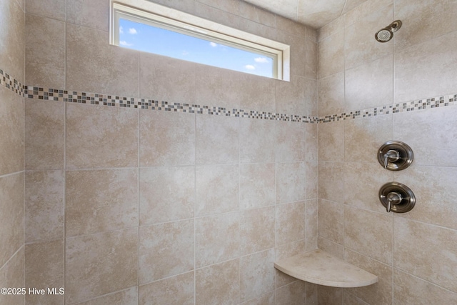 bathroom featuring tiled shower