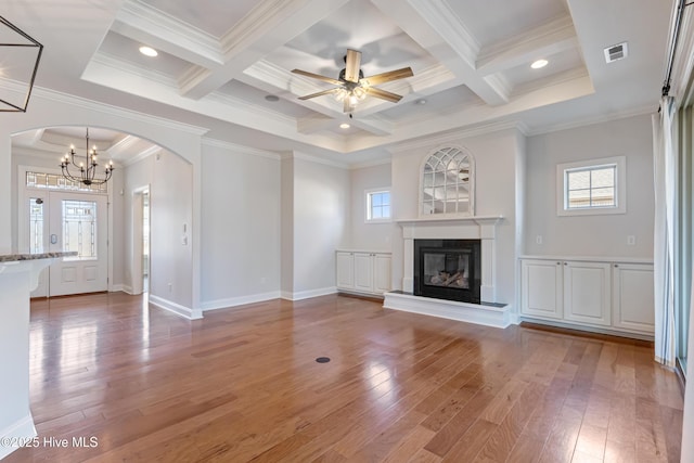 unfurnished living room featuring beamed ceiling, wood-type flooring, and coffered ceiling