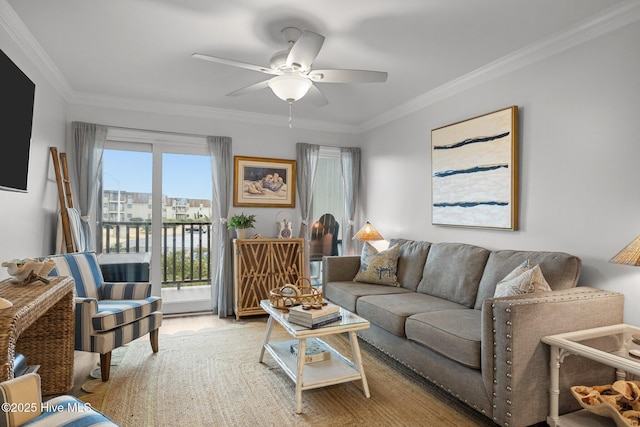 living area with wood finished floors, crown molding, and ceiling fan