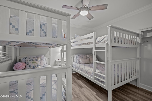 bedroom featuring a ceiling fan, crown molding, and wood finished floors