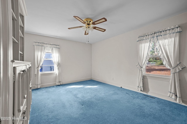 carpeted empty room with ceiling fan