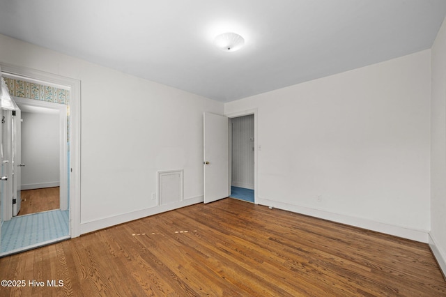 spare room featuring hardwood / wood-style flooring