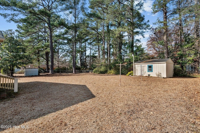 view of yard featuring a storage unit