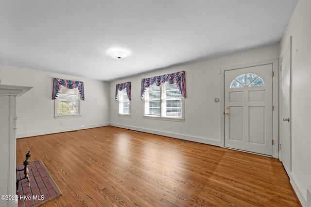 foyer entrance with hardwood / wood-style floors