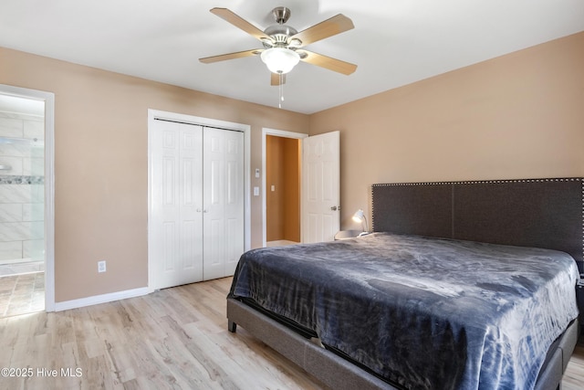 bedroom featuring ceiling fan, ensuite bathroom, a closet, and light wood-type flooring