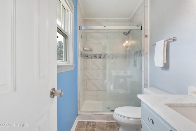 bathroom with vanity, an enclosed shower, and toilet