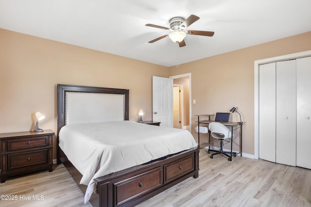 bedroom featuring ceiling fan, a closet, and light hardwood / wood-style flooring