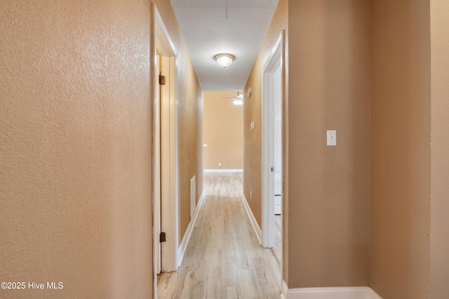 corridor featuring light wood-type flooring