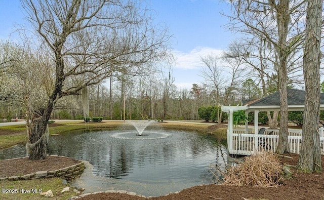 surrounding community with a gazebo and a water view