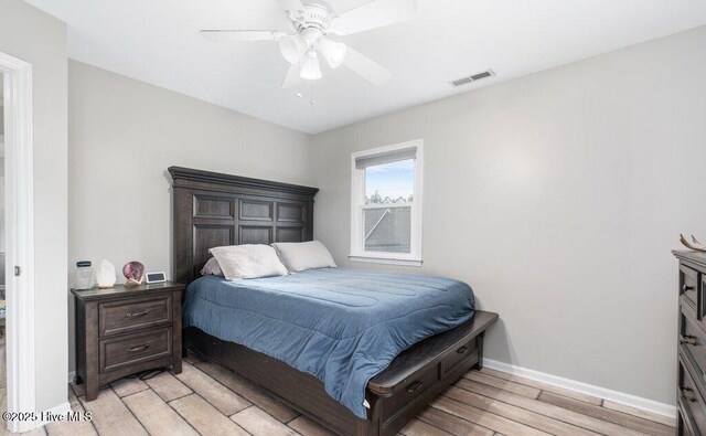 rec room featuring ornamental molding, light tile patterned flooring, plenty of natural light, and a fireplace with raised hearth