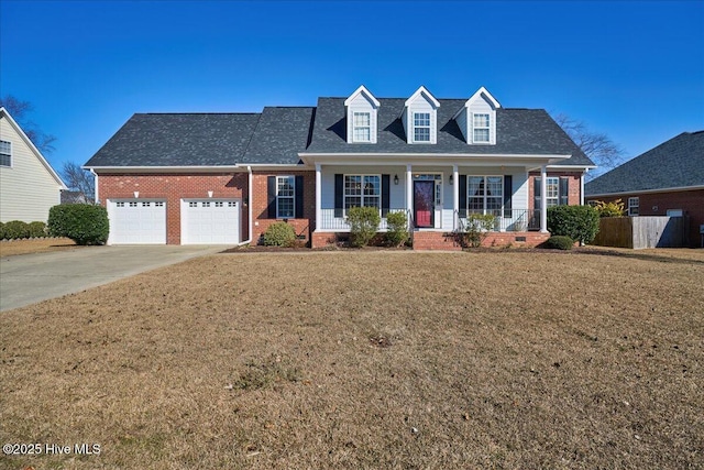 cape cod house with a garage, a front yard, and covered porch