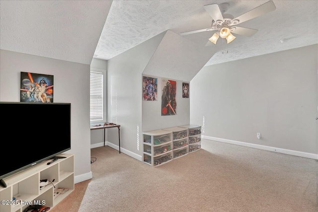 living room with vaulted ceiling, light carpet, a textured ceiling, and ceiling fan