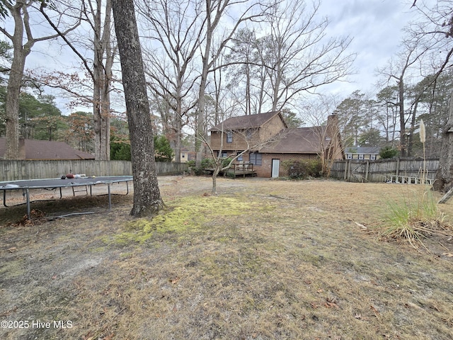 view of yard with a trampoline