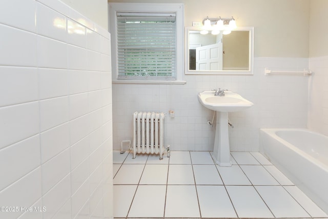 full bath with a tub, radiator heating unit, tile walls, and tile patterned floors