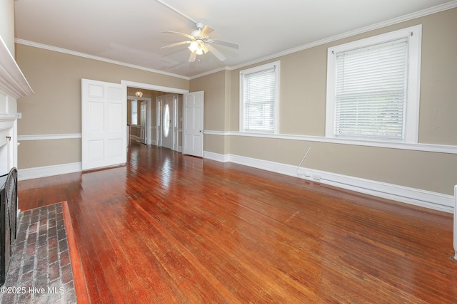 unfurnished living room with a fireplace with flush hearth, baseboards, crown molding, and wood finished floors