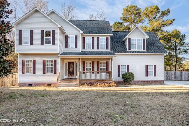 view of front of property with covered porch and a front yard