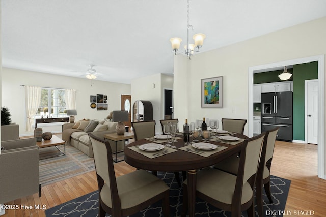 1652 Chadwick Shores Dr, Sneads Ferry, NC 28460 - dining room with light wood-style flooring, a chandelier, and ceiling fan