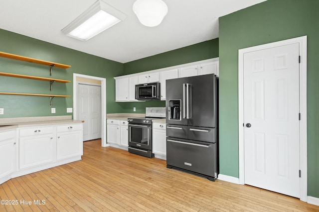 1652 Chadwick Shores Dr, Sneads Ferry, NC 28460 - kitchen featuring high end refrigerator, stainless steel electric range oven, light countertops, and white cabinets