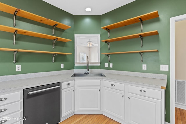 1652 Chadwick Shores Dr, Sneads Ferry, NC 28460 - kitchen featuring stainless steel dishwasher, open shelves, a sink, white cabinetry, and light wood-type flooring