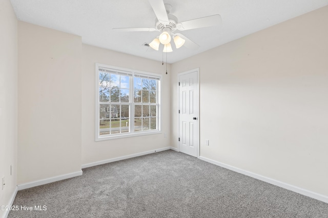 1652 Chadwick Shores Dr, Sneads Ferry, NC 28460 - carpeted spare room featuring baseboards and ceiling fan