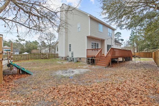 1652 Chadwick Shores Dr, Sneads Ferry, NC 28460 - back of house with a fenced backyard, a deck, a chimney, and central AC unit
